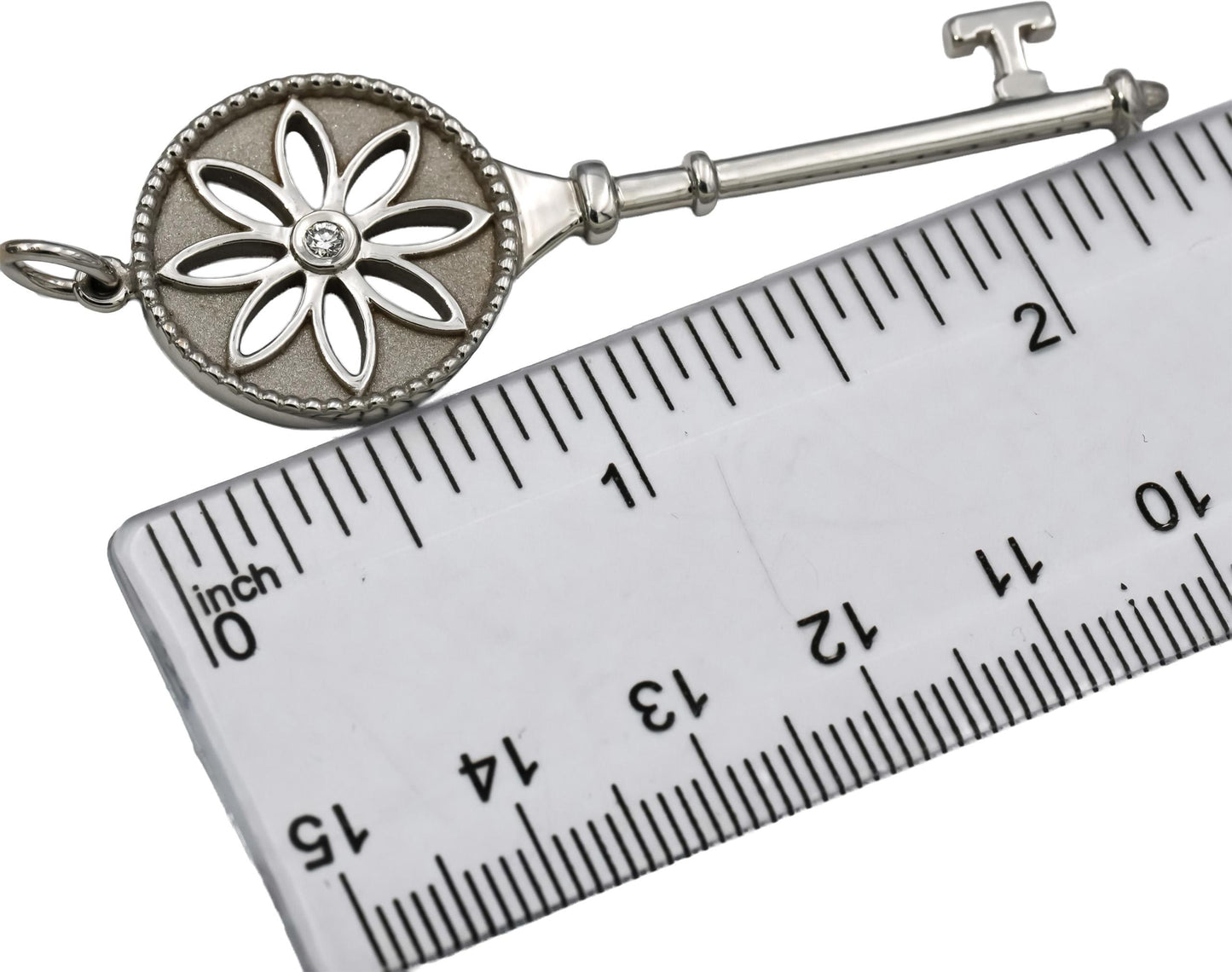 TIFFANY & CO. 18k White Gold VS Diamond Large Daisy Key Pendant 0.05CT