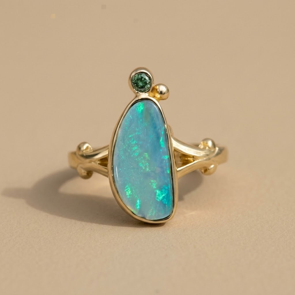 14k yellow gold cabochon opal cocktail ring with green diamond accent